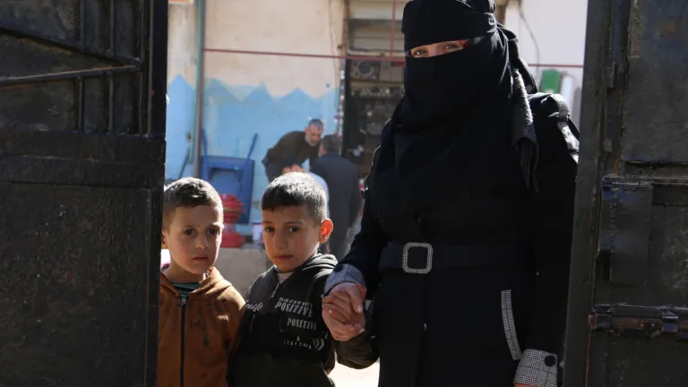 Baraa taking her children to daycare Credit SARD