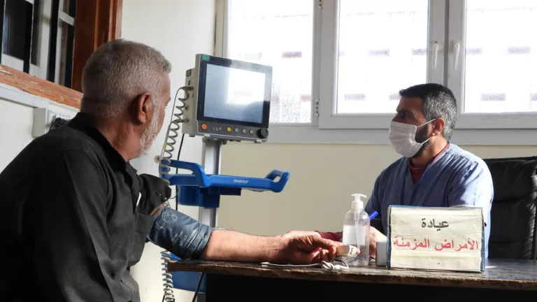 Medical staff attend to a patient at Ali Bajliyeh Health Centre